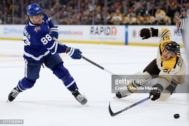 Matthew Poitras of the Boston Bruins dives defending a shot from William Nylander of the Toronto Maple Leafs during overtime at TD Garden on November...