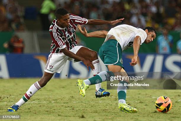 Willians of Fluminense struggles for the ball during a match between Fluminense and Goias as part of Brazilian Cup 2013 at Maracana Stadium on August...