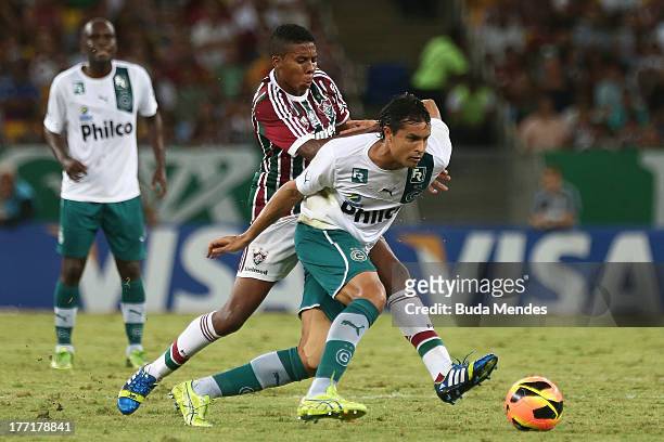 Willians of Fluminense struggles for the ball during a match between Fluminense and Goias as part of Brazilian Cup 2013 at Maracana Stadium on August...