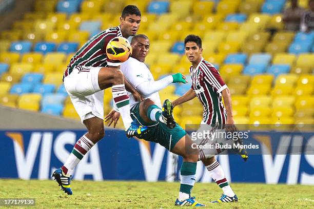 Gum of Fluminense struggles for the ball with Walter of Goias during a match between Fluminense and Goias as part of Brazilian Cup 2013 at Maracana...
