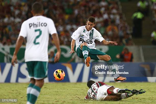 Willians of Fluminense struggles for the ball on the ground during a match between Fluminense and Goias as part of Brazilian Cup 2013 at Maracana...