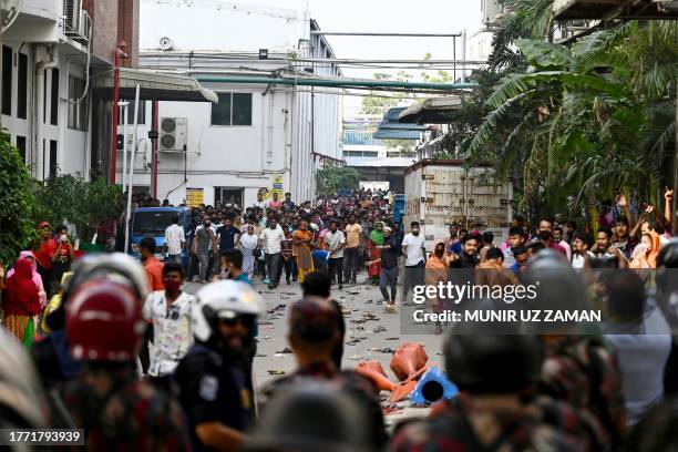 Garment workers clash with police personnel during a rally in Gazipur on November 9, 2023. Up to 25,000 garment workers clashed with police in...