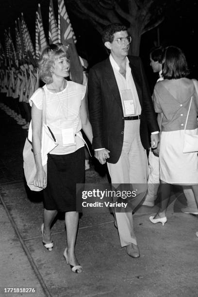 Cyndy Garvey and Marvin Hamlisch attend an event at the Bel-Air Country Club in the Bel-Air neighborhood of Los Angeles, California, on July 28, 1984.
