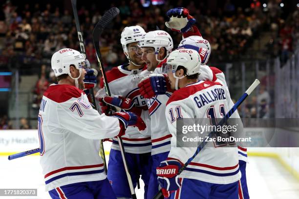 Sean Monahan of the Montreal Canadiens celebrates after scoring a goal during the first period with Tanner Pearson, Brendan Gallagher, and Johnathan...