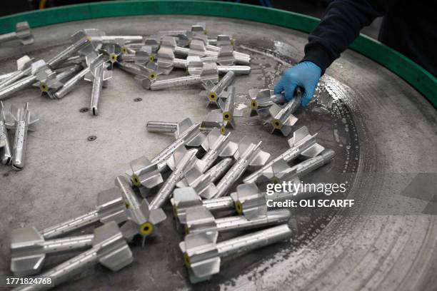 Systems employee works on the tail section of 81mm High Explosive Mortar munitions at the BAE Systems factory in Washington, near Newcastle upon Tyne...