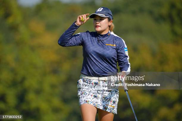 Shiho Kuwaki of Japan acknowledges the gallery after the birdie on the 5th green during the second round of the TOTO Japan Classic at the Taiheiyo...