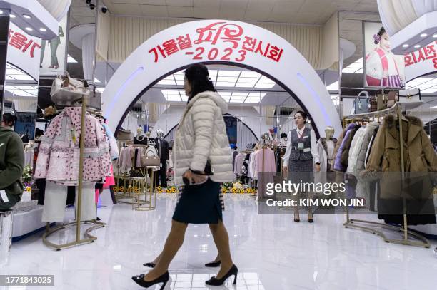 Visitors attend the opening of the 2023-Autumn Garment Exhibition at the Okryu Exhibition House in Pyongyang on November 9, 2023.