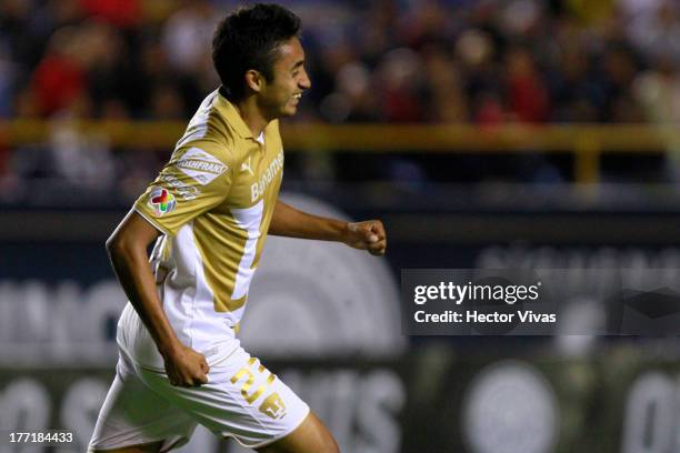 Jose Nieto of Pumas celebrates during a match between San Luis and Pumas as part of the Apertura 2013 Copa MX at Alfonso Lastras Stadium on August...