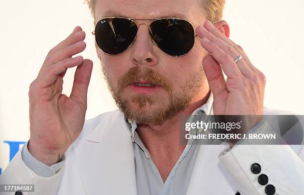 Actor Simon Pegg poses on arrival for the L.A. Premiere of the film 'The World's End' in Hollywood, California, on August 21 2013. AFP PHOTO/Frederic...