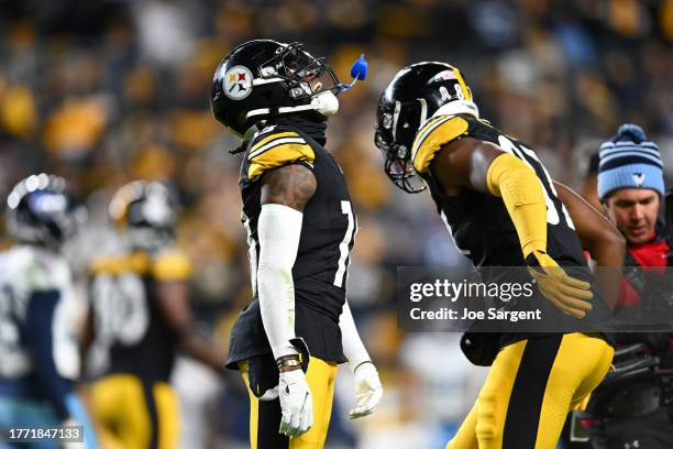 Diontae Johnson of the Pittsburgh Steelers and Rodney Williams of the Pittsburgh Steelers celebrate Johnson's touchdown in the fourth quarter against...