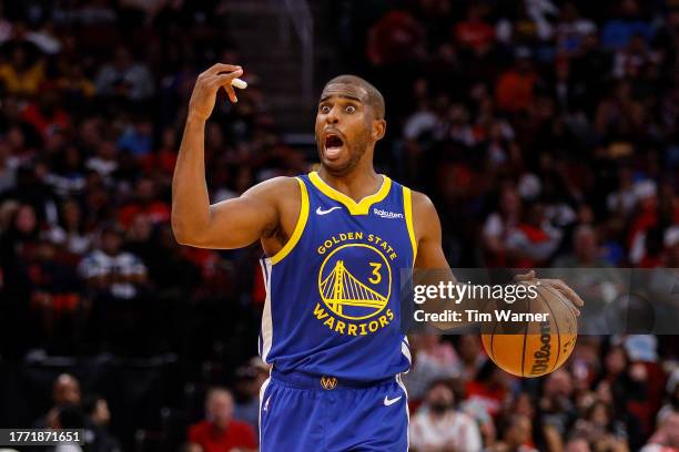 Chris Paul of the Golden State Warriors brings the ball up court in the second half against the Houston Rockets at Toyota Center on October 29, 2023...