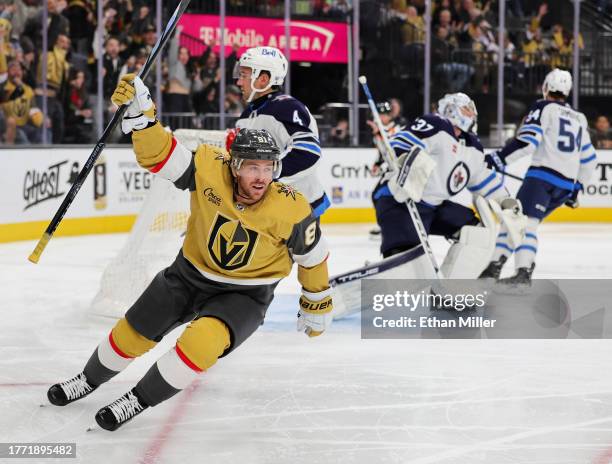 Jonathan Marchessault of the Vegas Golden Knights celebrates his second-period power-play goal against Connor Hellebuyck of the Winnipeg Jets during...