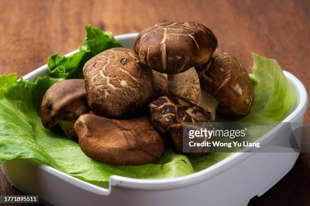 shitake mushroom in a bowl - porcini mushroom stock pictures, royalty-free photos & images
