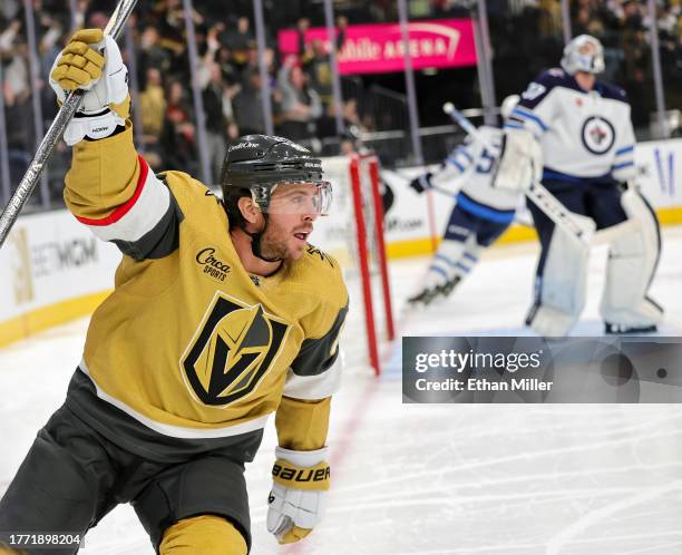 Jonathan Marchessault of the Vegas Golden Knights celebrates his second-period power-play goal against Connor Hellebuyck of the Winnipeg Jets during...