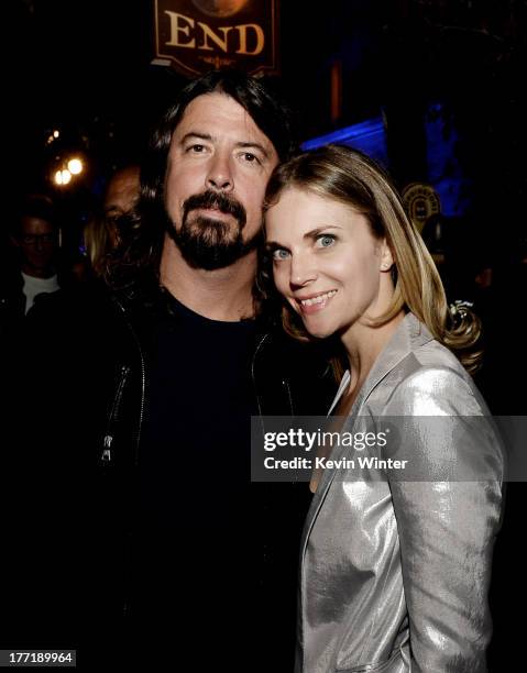 Musician Dave Grohl and his wife Jordyn Blum pose at the after party for the premiere of Focus Features' "The World's End" at the Cat and Fiddle on...