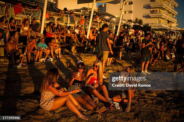 Tourists gather to watch the sunset in front of Cafe del Mar in Sant Antonio on August 21, 2013 near Ibiza, Spain. The small island of Ibiza lies...