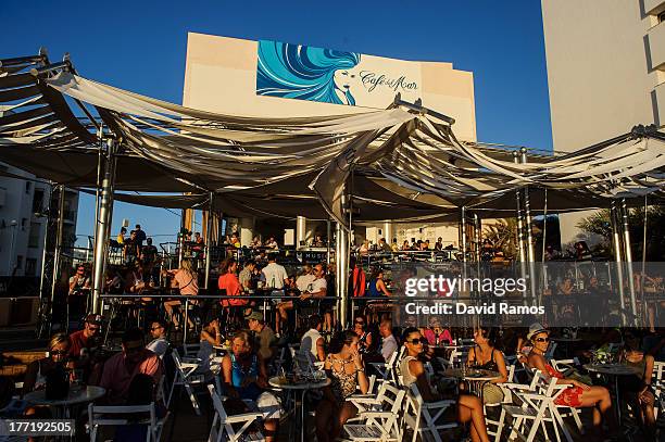 People sit at Cafe del Mar in Sant Antonio on August 21, 2013 near Ibiza, Spain. The small island of Ibiza lies within the Balearics islands, off the...