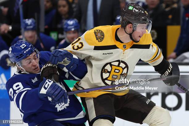 Pontus Holmberg of the Toronto Maple Leafs collides with Charlie Coyle of the Boston Bruins during the third period at TD Garden on November 02, 2023...