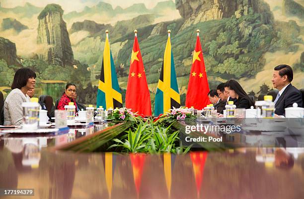 Jamaican Prime Minister Portia Simpson Miller and Chinese President Xi Jinping attend talks at the Great Hall of the People, on August 22, 2013 in...