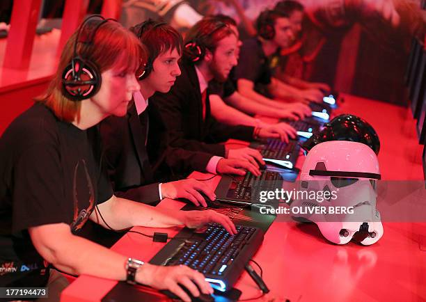 Computer games enthusiasts play during the gamescom fair in Cologne, western Germany on August 22, 2013. The trade fair for interactive games and...