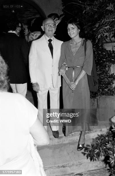 Irving "Swifty" Lazar and Tracy Tynan attend an opening at the Westwood Playhouse and an afterparty at the Ginger Man, both in Westwood, California,...