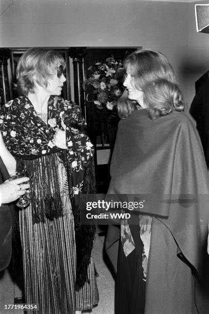 Shirley MacLaine and Kathleen Tynan attend a party at the Sassoon residence in Los Angeles, California, on May 27, 1978.