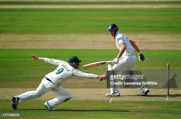 Riki Wessels of Nottinghamshire dives at full stretch to try and catch Steve Patterson of Yorkshire during day two of the LV County Championship...