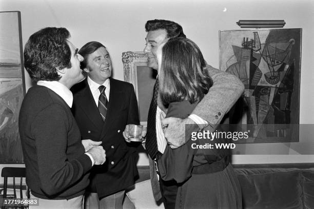 Anthony Newley, Mike Douglas, Mike Connors, and Marylou Connors attend a party in the Brentwood neighborhood of Los Angeles, California, on January...
