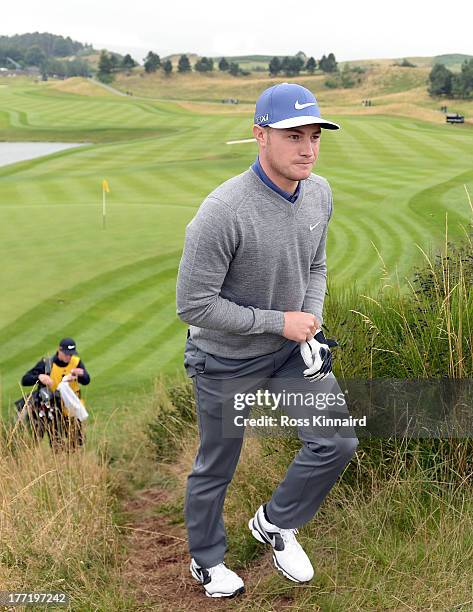 Oliver Fisher of England maks his way off of the 9th green during the first round of the Johnnie Walker Championship at Gleneagles on August 22, 2013...