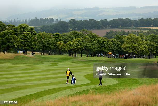 Mikael Lundberg of Sweden plays his second shot into the 18th green during the first round of the Johnnie Walker Championship at Gleneagles on August...