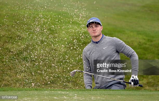 Oliver Fisher of England in action during the first round of the Johnnie Walker Championship at Gleneagles on August 22, 2013 in Auchterarder,...