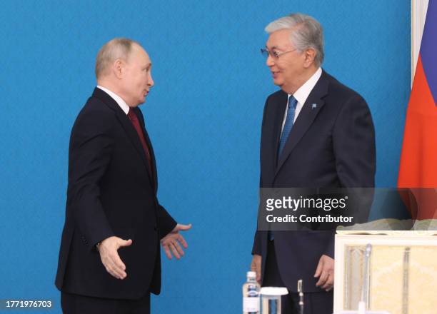 Kazakh President Kassym-Jomart Tokayev greets Russian President Vladimir Putin during their meeting at the Ak Orda Presidential Palace, November 9,...