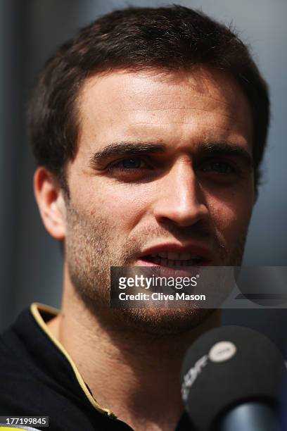Jerome D'Ambrosio of Belgium is interviewed by the media during previews to the Belgian Grand Prix at Circuit de Spa-Francorchamps on August 22, 2013...