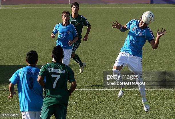 Afghan footballers from Tofaan Harirod and Spinghar Bazan fight for the ball during game of the Roshan Afghan premiere league at the Afghanistan...