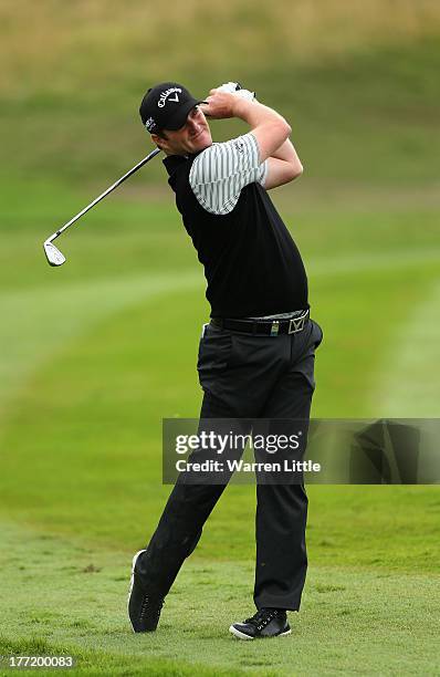Marc Warren of Scotland in action during the first round of the Johnnie Walker Championship at Gleneagles on August 22, 2013 in Auchterarder,...