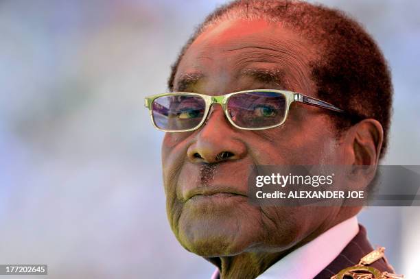 Zimbabwean President Robert Mugabe looks on during his inauguration and swearing-in ceremony on August 22, 2013 at the 60,000-seater sports stadium...