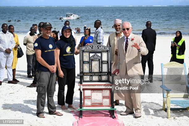 King Charles III meets members of Flipflopi, a movement which aims to end single use plastic, transforming and upcycling litter to preserve the...