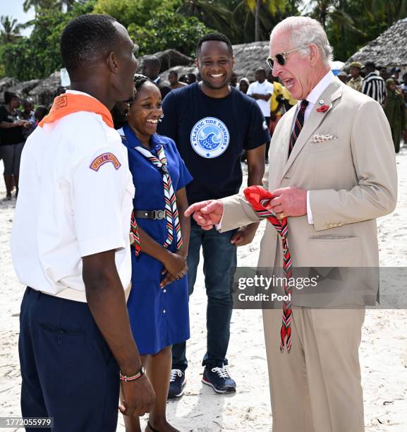 King Charles III meets members of Flipflopi, a movement which aims to end single use plastic, transforming and upcycling litter to preserve the...