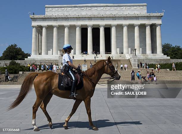 Park Police officer on horseback rides past the Lincoln Memorial in Washington, DC on August 22, 2013. A full week of activities are planned ahead of...