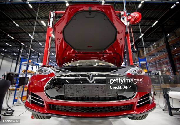 View of a fully electric Tesla car on an assembly line at the new Tesla Motors car factory in Tilburg, the Netherlands, during the opening and launch...