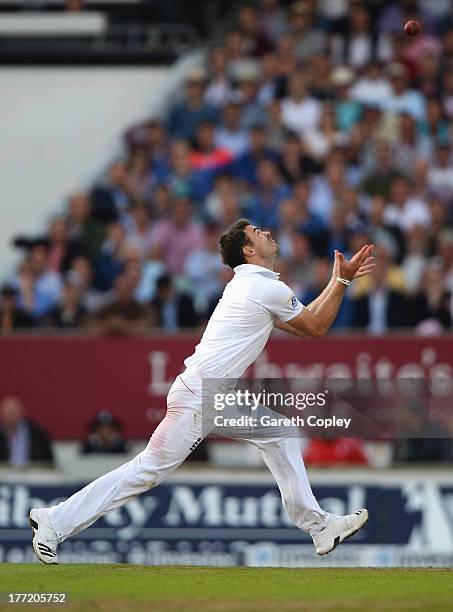 James Anderson of England takes a catch off his own bowling to dismiss Ryan Harris of Australia during day two of the 5th Investec Ashes Test match...