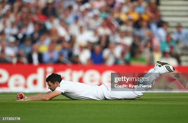 James Anderson of England takes a catch off his own bowling to dismiss Ryan Harris of Australia during day two of the 5th Investec Ashes Test match...