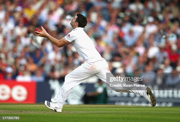 James Anderson of England takes a catch off his own bowling to dismiss Ryan Harris of Australia during day two of the 5th Investec Ashes Test match...