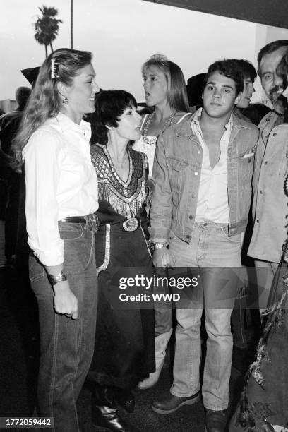 Terry McQueen , Neile Adams , and Chad McQueen attend an event at the Santa Monica Civic Auditorium in Santa Monica, California, on May 11, 1982.