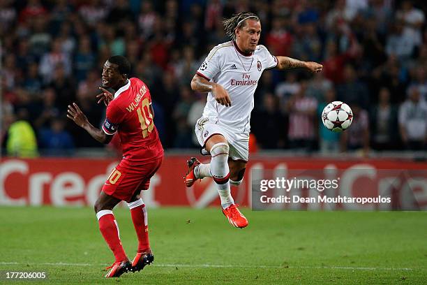 Georgino Wijnaldum of PSV and Philippe Mexes of AC Milan battle for the ball during the UEFA Champions League Play-off First Leg match between PSV...