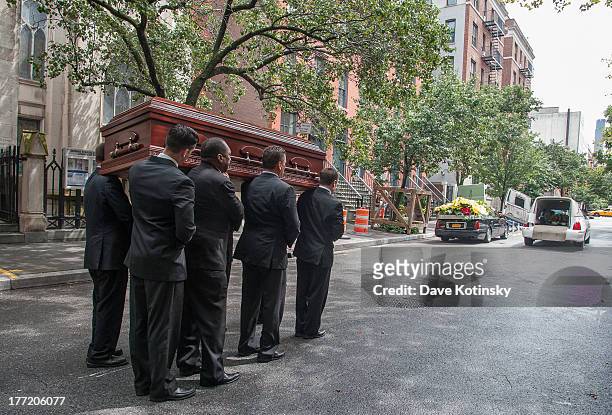 Pallbearers carry the coffin at the funeral for former "Bachelor" contestant Gia Allemand at Trinity Grace Church on August 22, 2013 in New York, New...