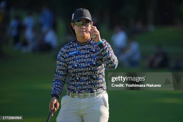 Fumika Kawagishi of Japan acknowledges the gallery after holing out on the 18th green during the second round of the TOTO Japan Classic at the...