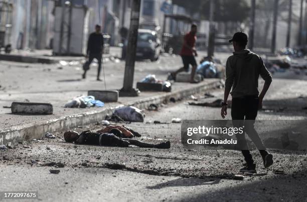 Dead bodies are seen on the Nasir street near the Al-Shifa hospital after an Israeli attack on its 34th day in Gaza City, Gaza on November 9, 2023.