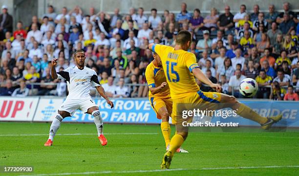 Swansea player Wayne Routledge scores the opening goal during the UEFA Europa League play-off first leg between Swansea City and FC Petrolul Ploiesti...