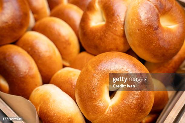 closed up of fresh bagels - sesame stock pictures, royalty-free photos & images
